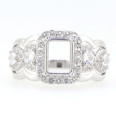 Sterling silver semi mount ring setting with crisscross swirl shank design, featuring a vacant center for an emerald.